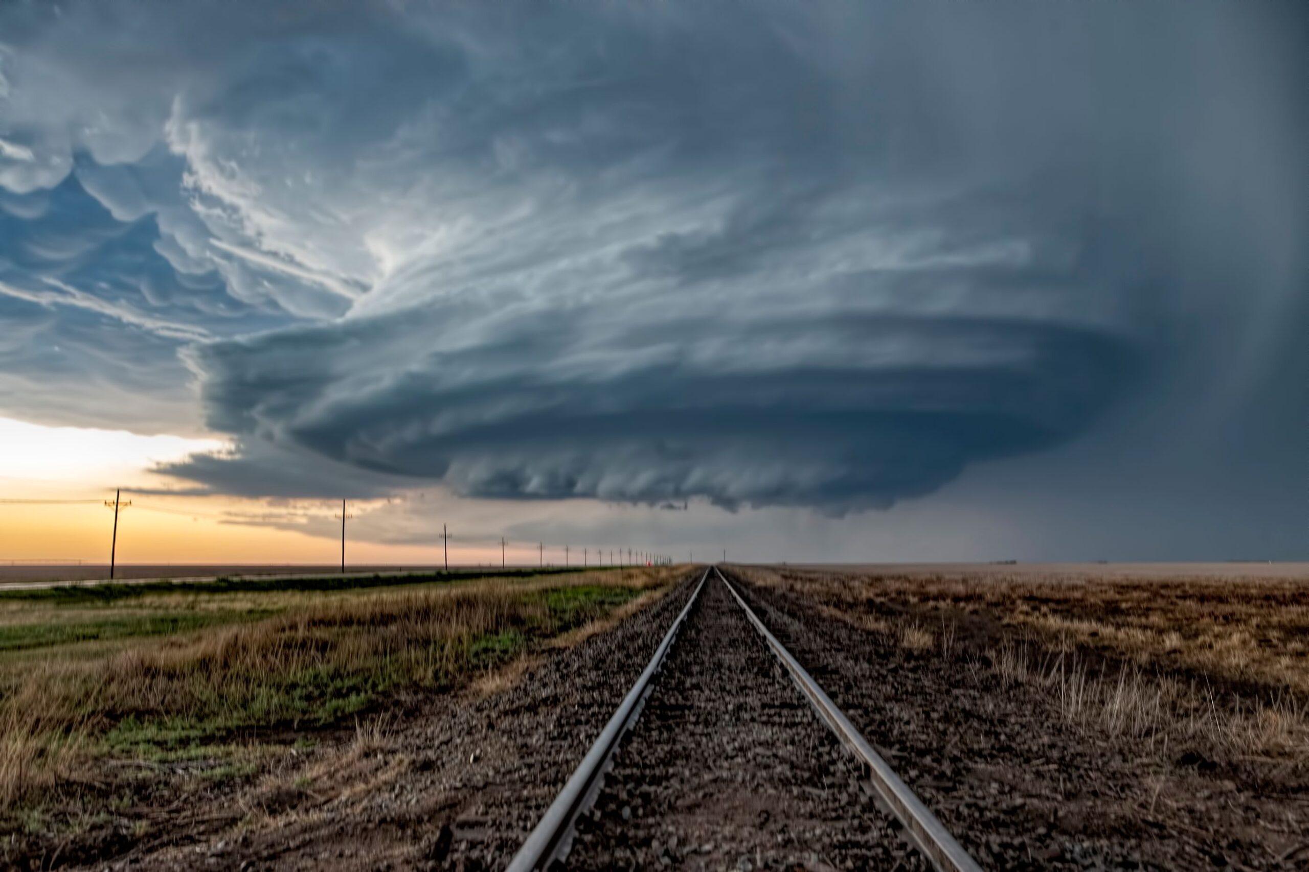 A developing supercell thunderstorm moved over Satanta Kansas near sunset.