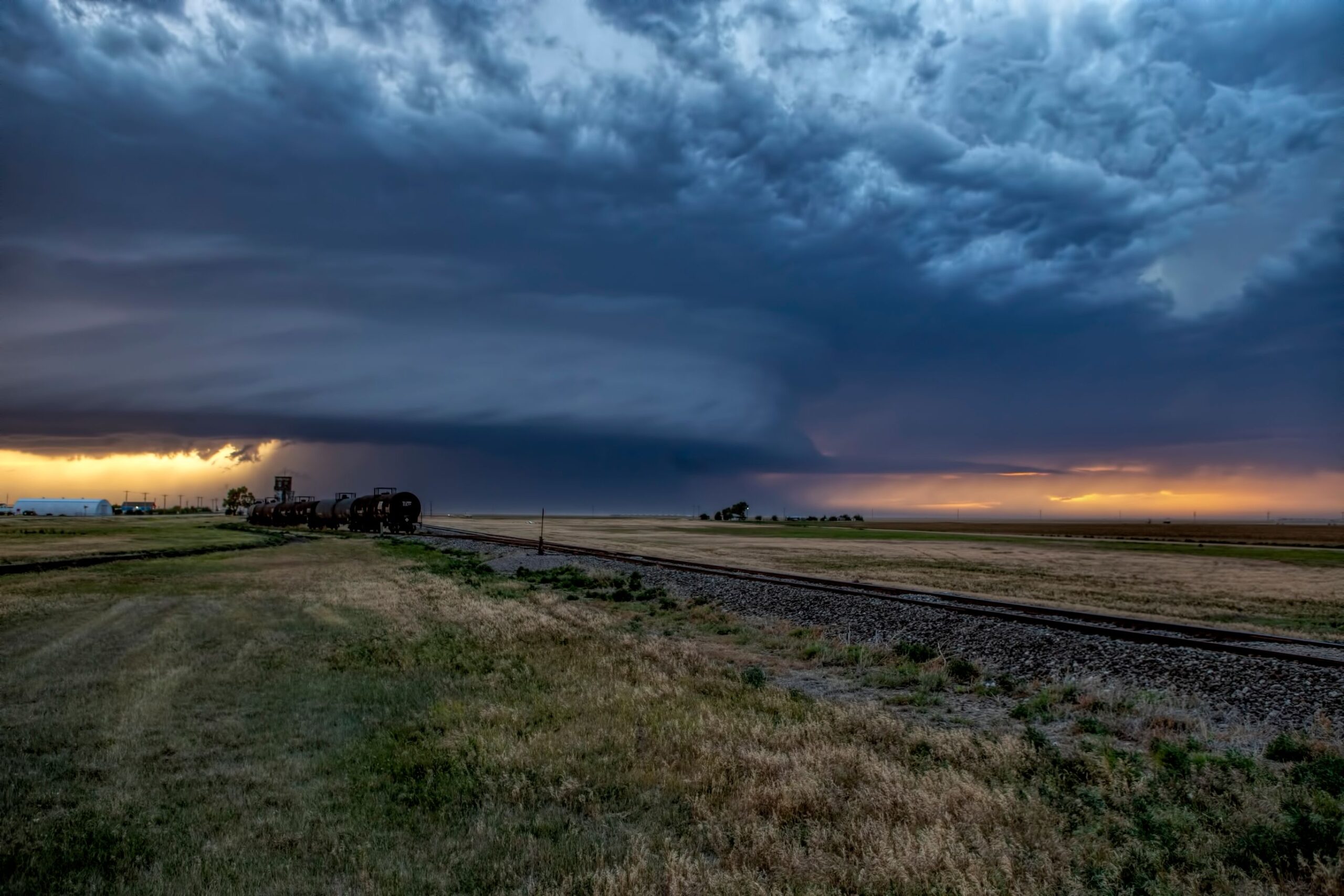 A supercell thunderstrom approaches Rolla Kansas at sunset.