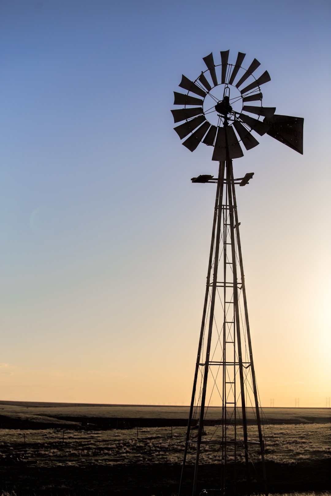 A lone windmill sits atop the high plains in western Hamilton County Kansas