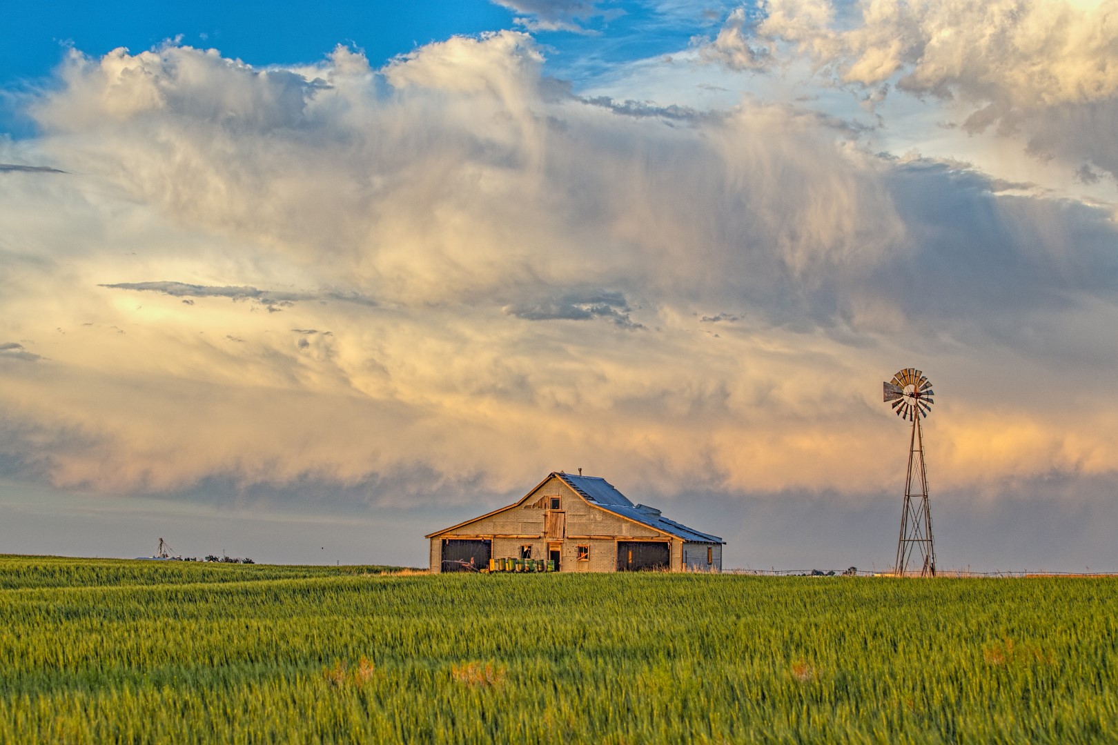 A passing storm near a machine shed in the Oklahoma panhandle