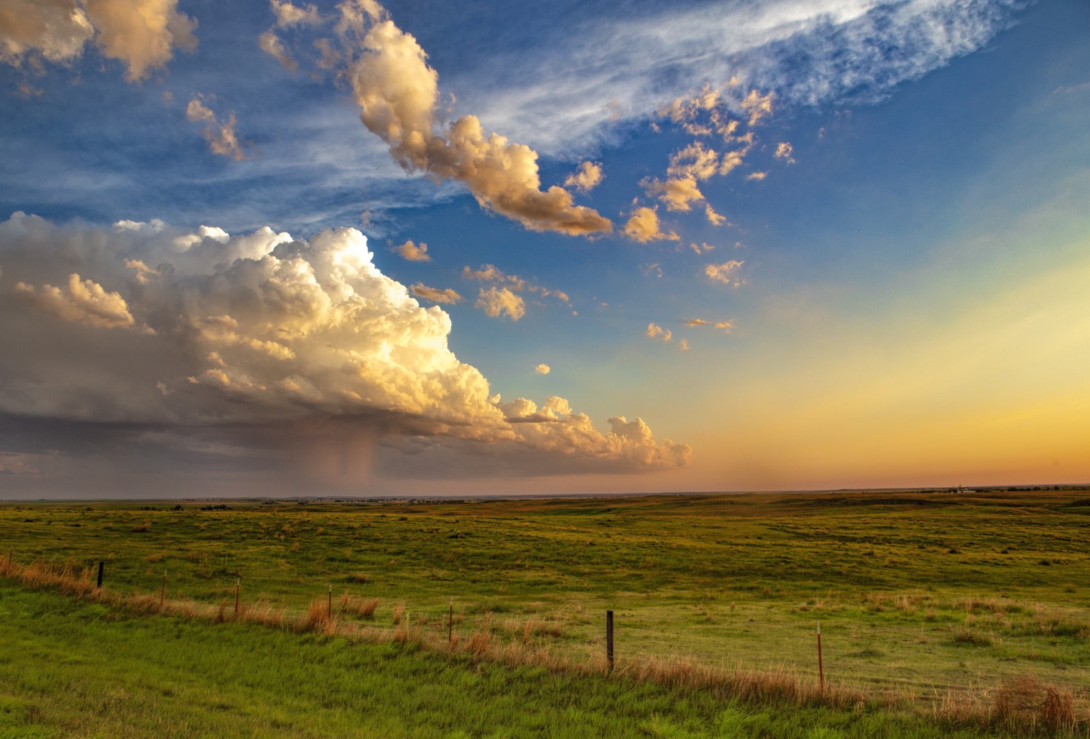 The final remnants of a dying storm move across the Oklahoma prairie as the sun sets.